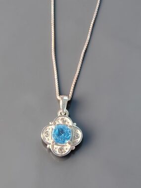 Blue Topaz Gemstone Floral Pendant Necklace In Sterling Silver